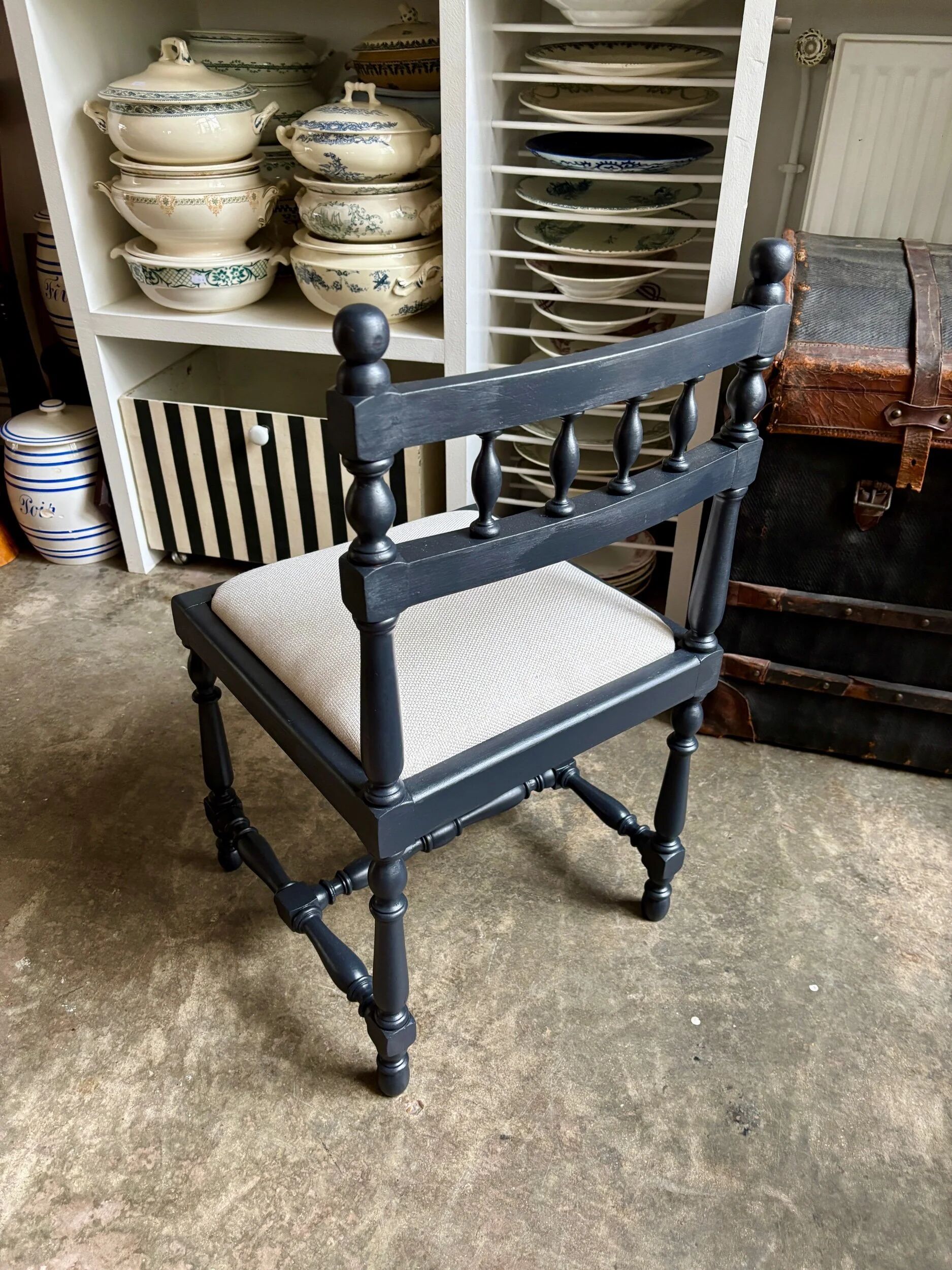 Black turned wooden chair and ivory cotton.