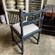 Black turned wooden chair and ivory cotton.