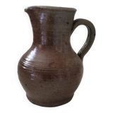 Old miniature pitcher. Sandstone
