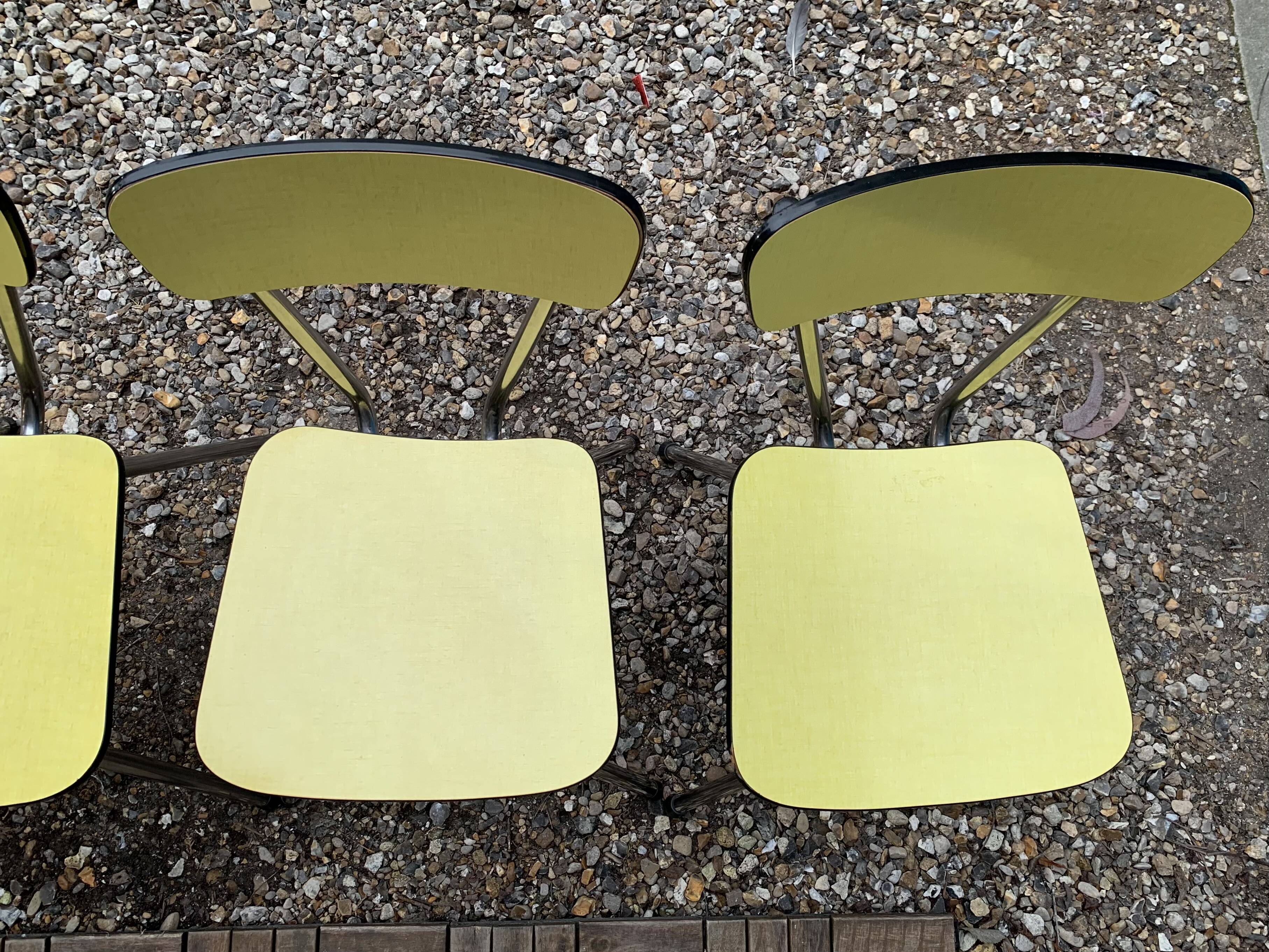 Yellow Formica chairs with compass legs, 1950s