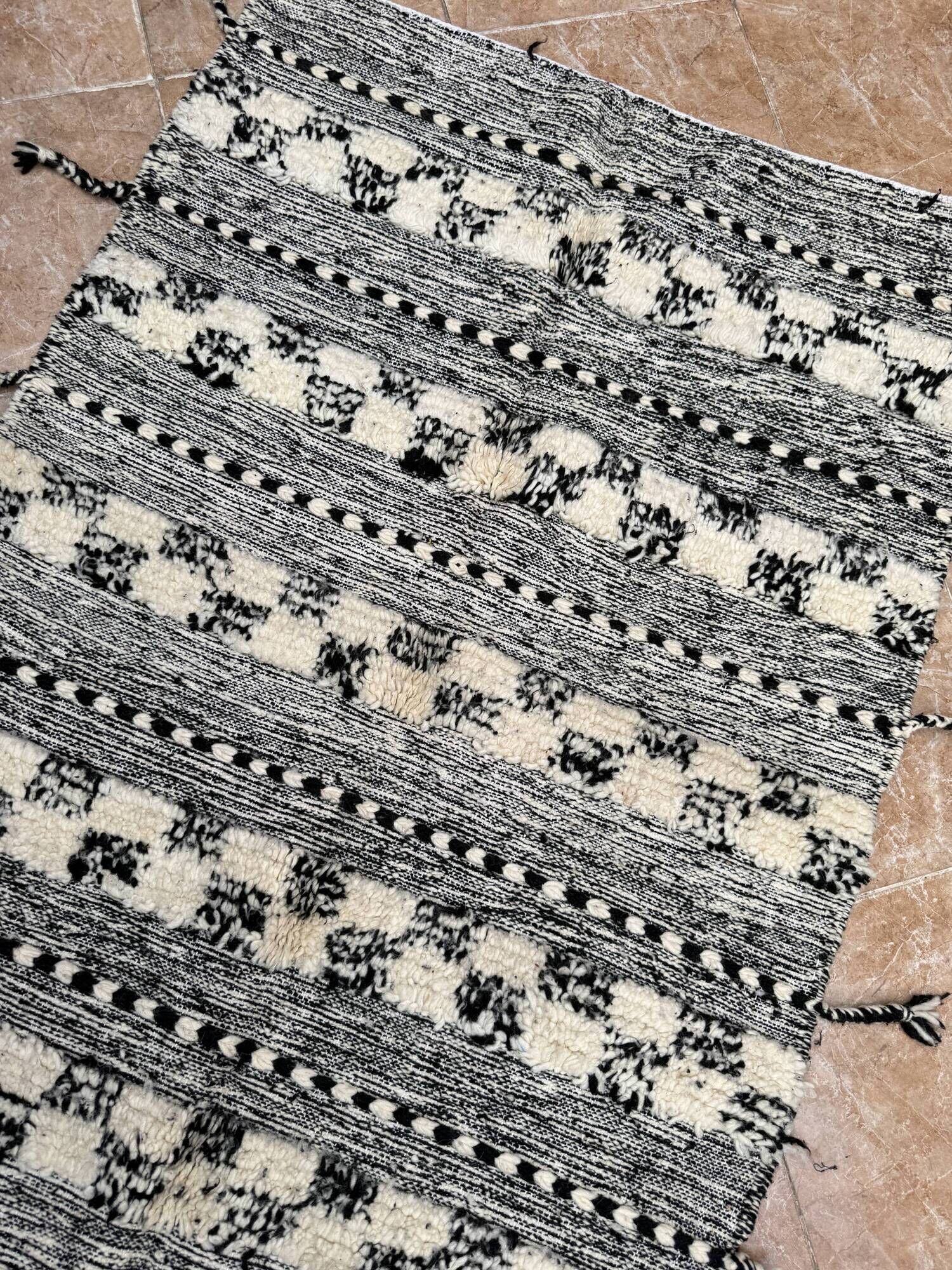 Small black Moroccan Berber Zanafi kilim rug for bedroom and living room.