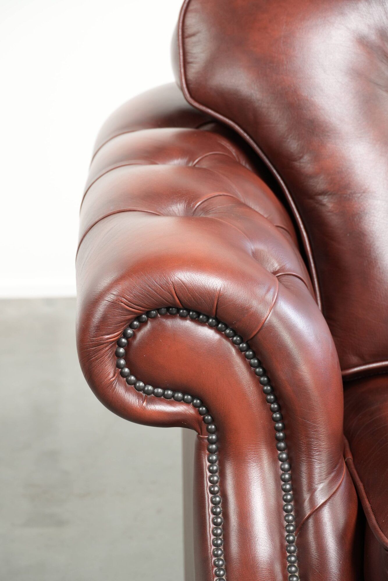 Brown cow leather Chesterfield armchair in a unique design