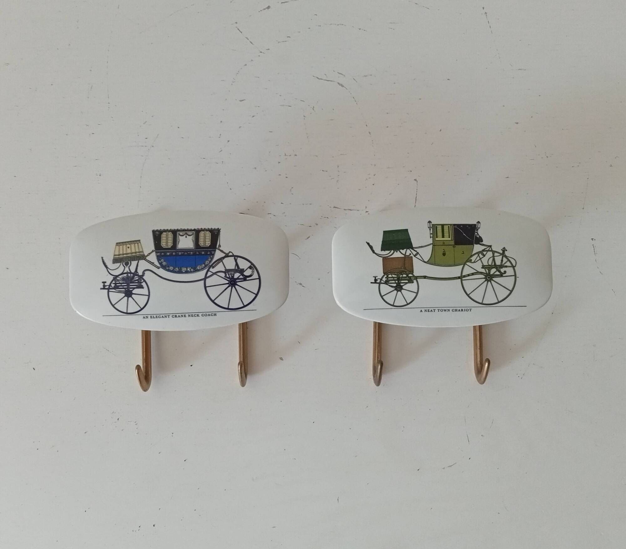 Set of 2 wall coat hooks in Bakelite and brass from the 1950s/60s.