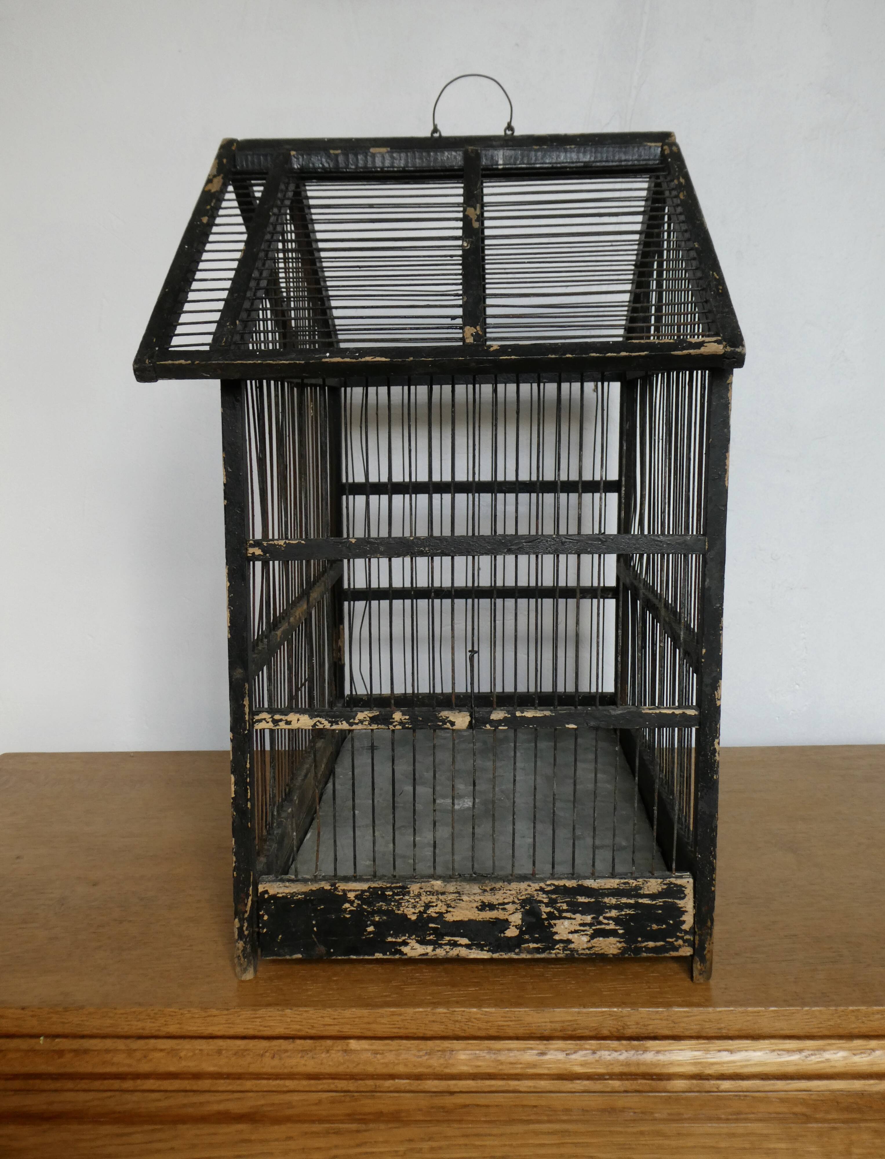 Wooden bird cage, original black patina, early 20th century