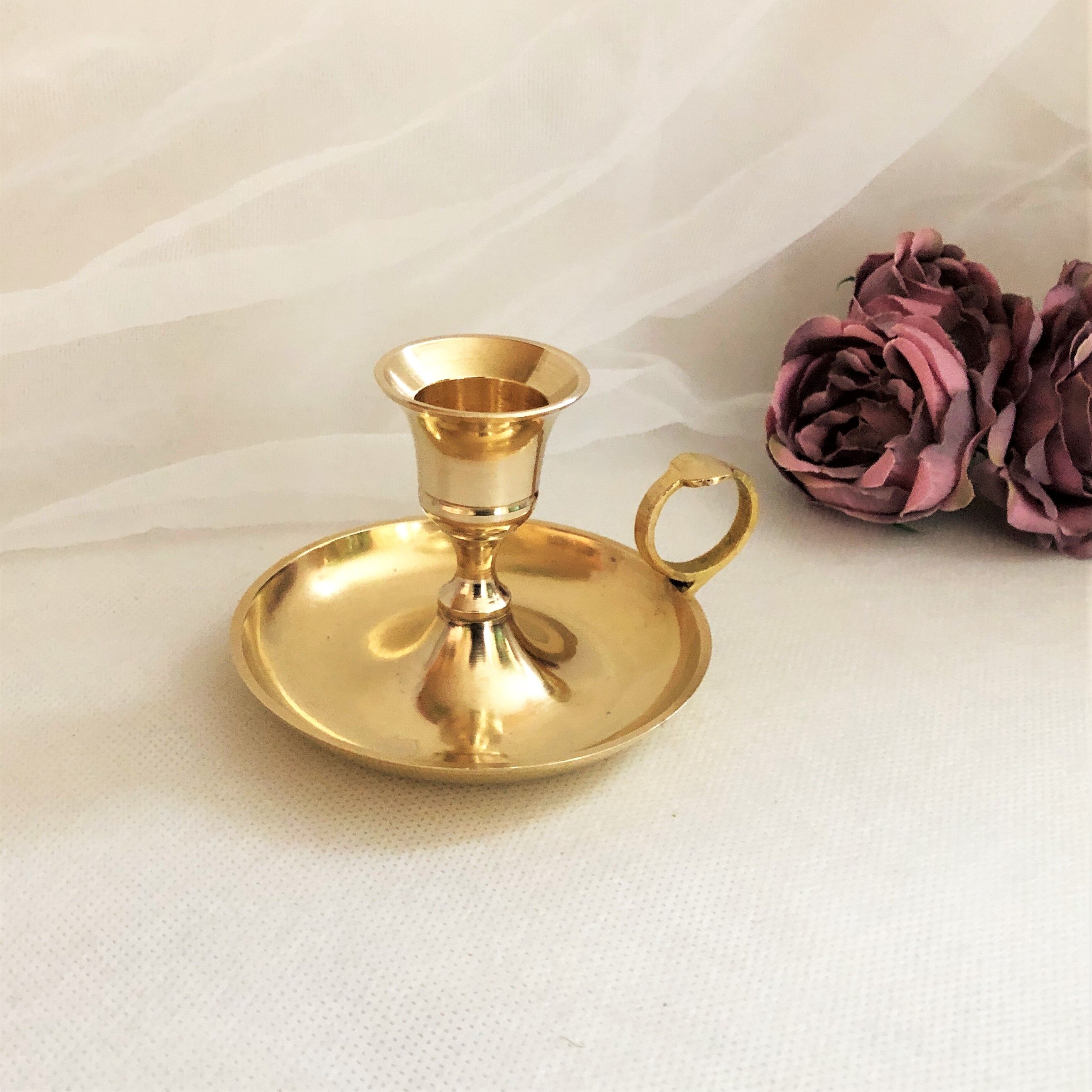 Gilded brass hand candle holder