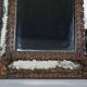 Antique brass repoussé mirror with wooden backing, 59x31 cm, C831.