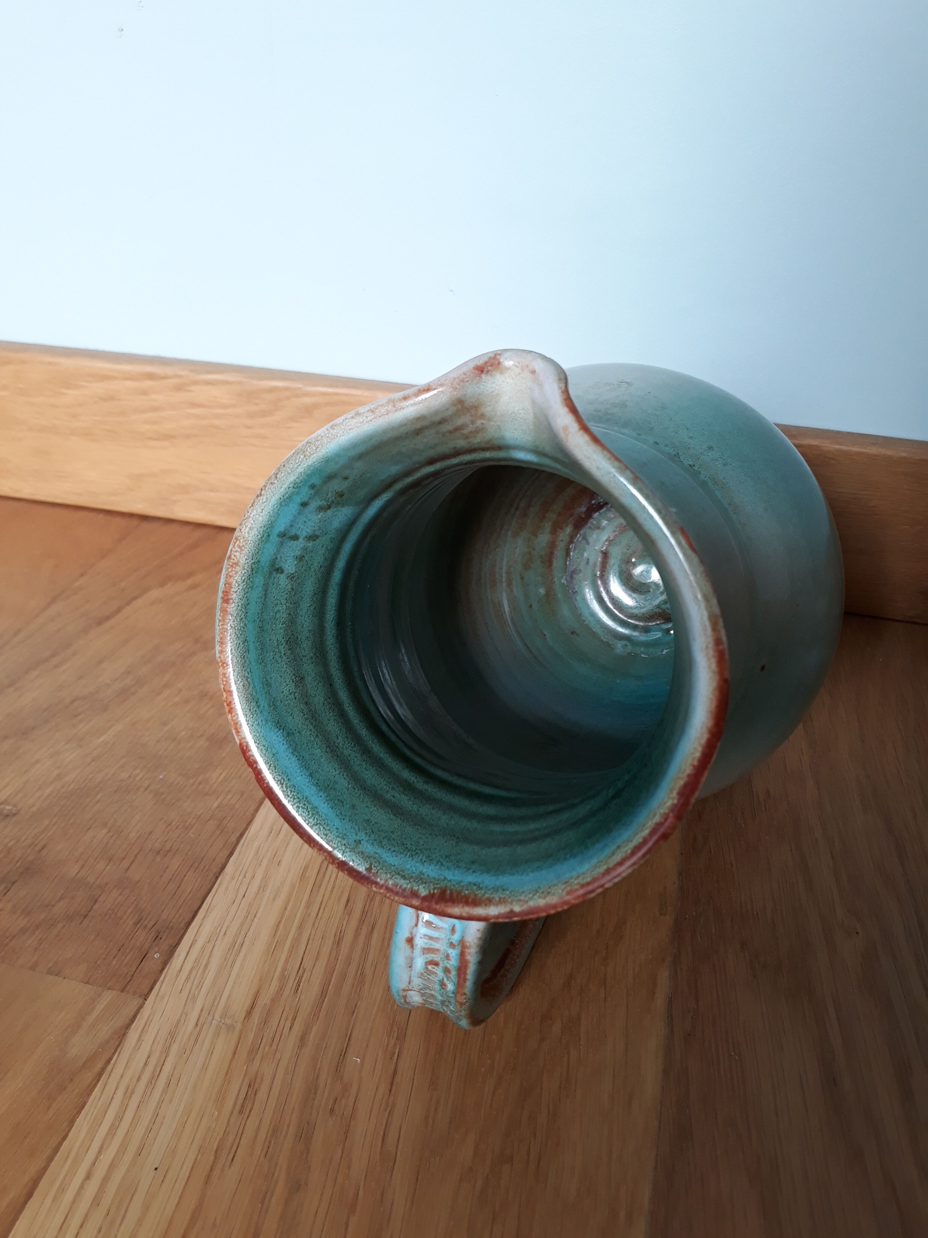 Pitcher with handle green celadon turquoise and caramel