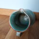Pitcher with handle green celadon turquoise and caramel