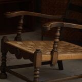 A pair of modern and sculptural vintage Danish armchairs in oak and papercord, 1940s.