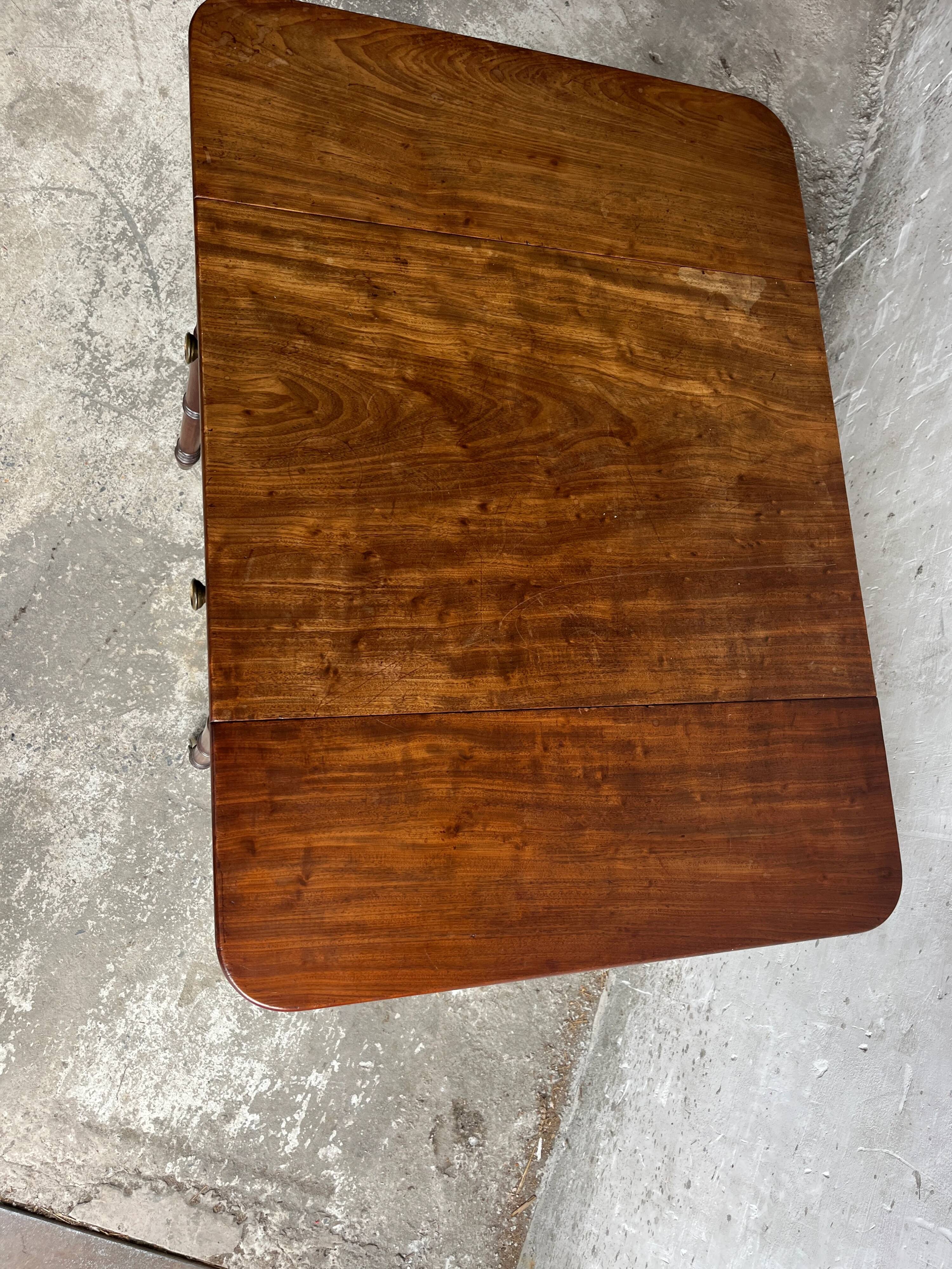 Antique drop-leaf side table on wheels