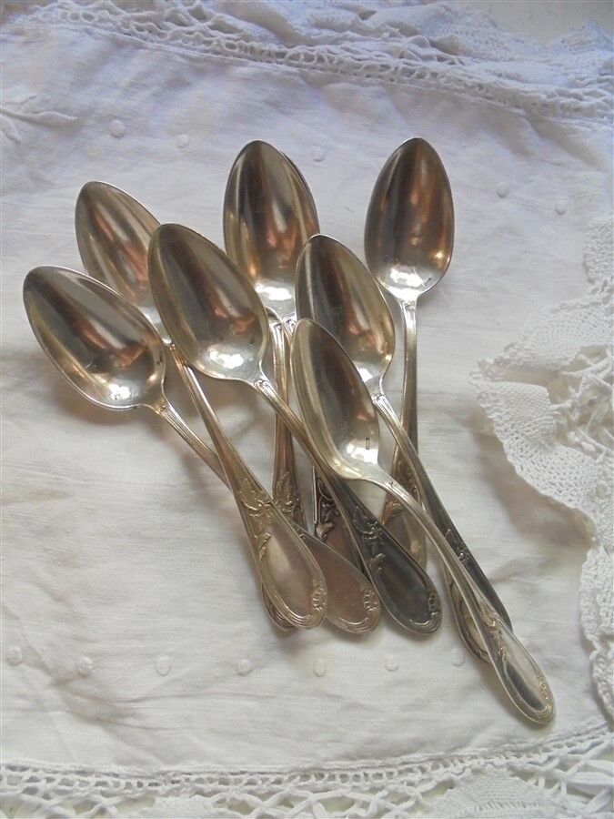 8 teaspoons made of silver metal
