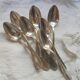 8 teaspoons made of silver metal