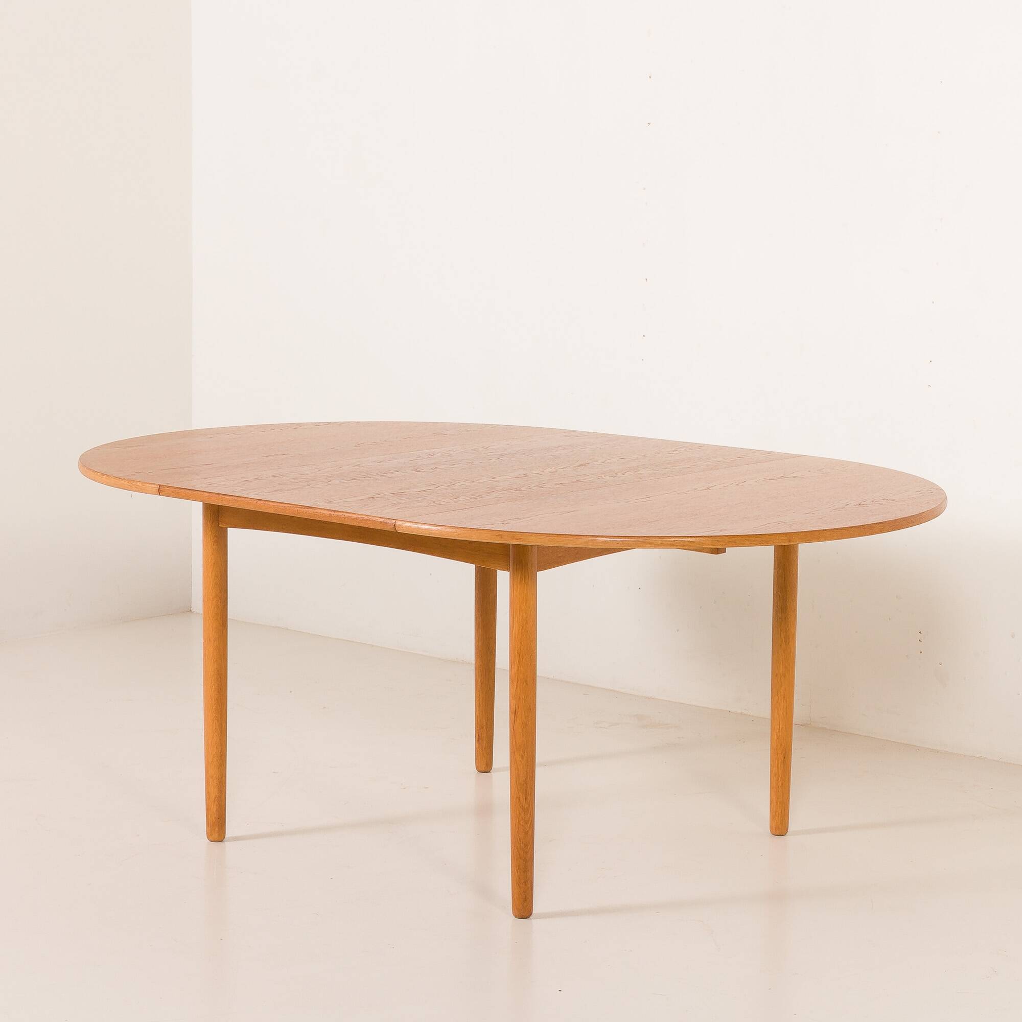 Danish Oak round dining table with one extension, 1970s