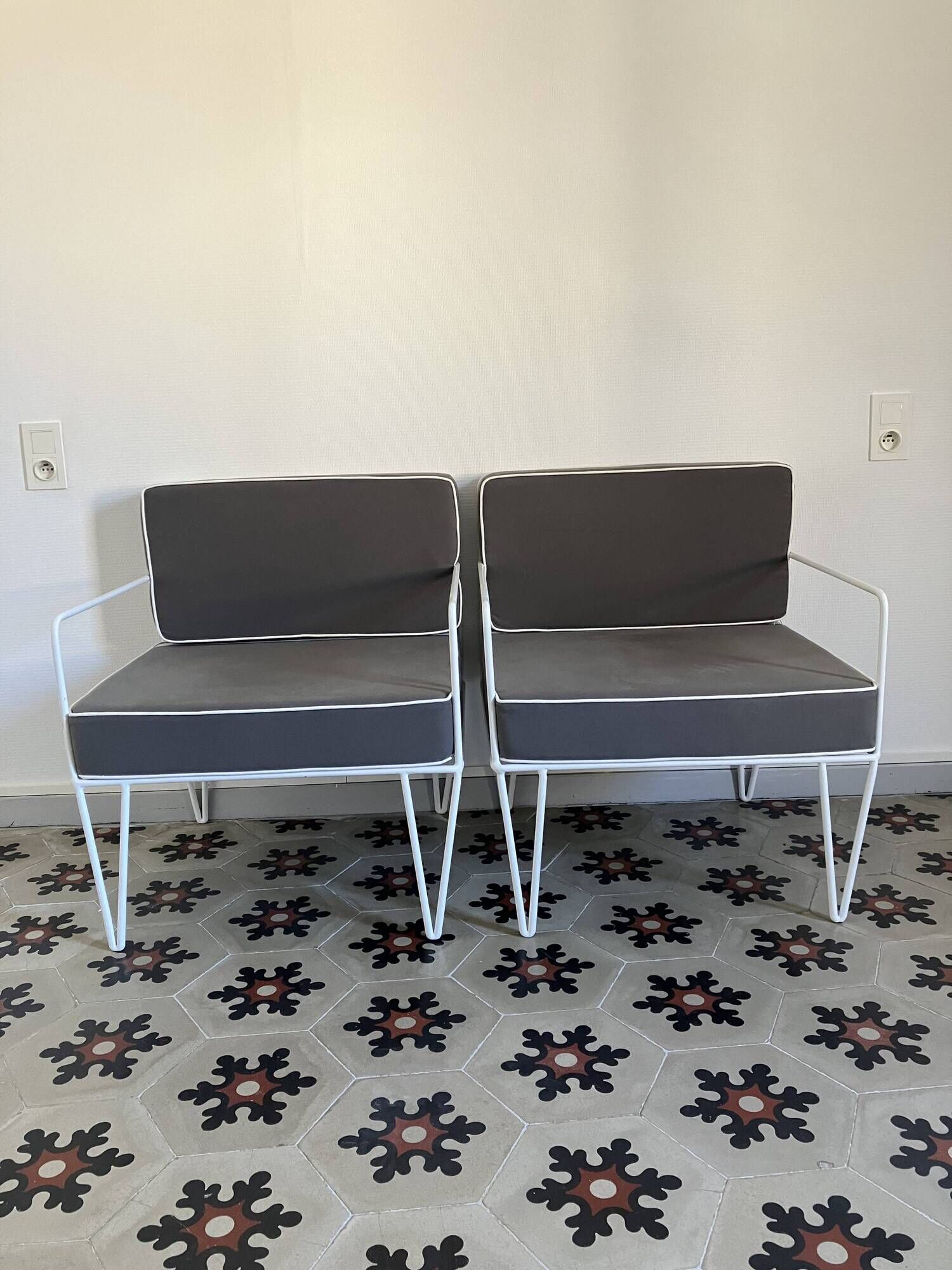 Vintage white metal Croisette style armchairs with hairpin legs in superb condition