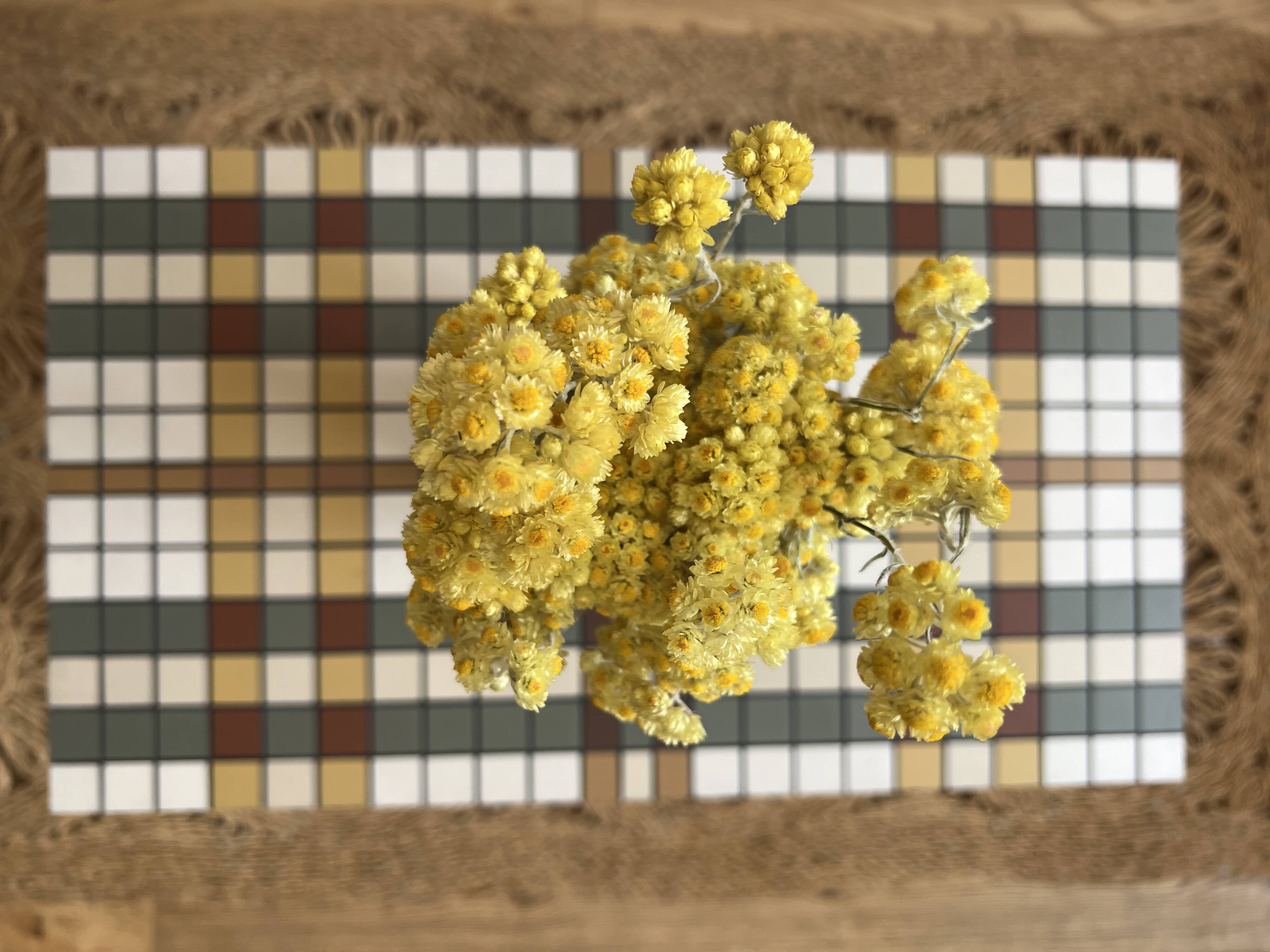 Small mosaic bedside table with tapered legs.