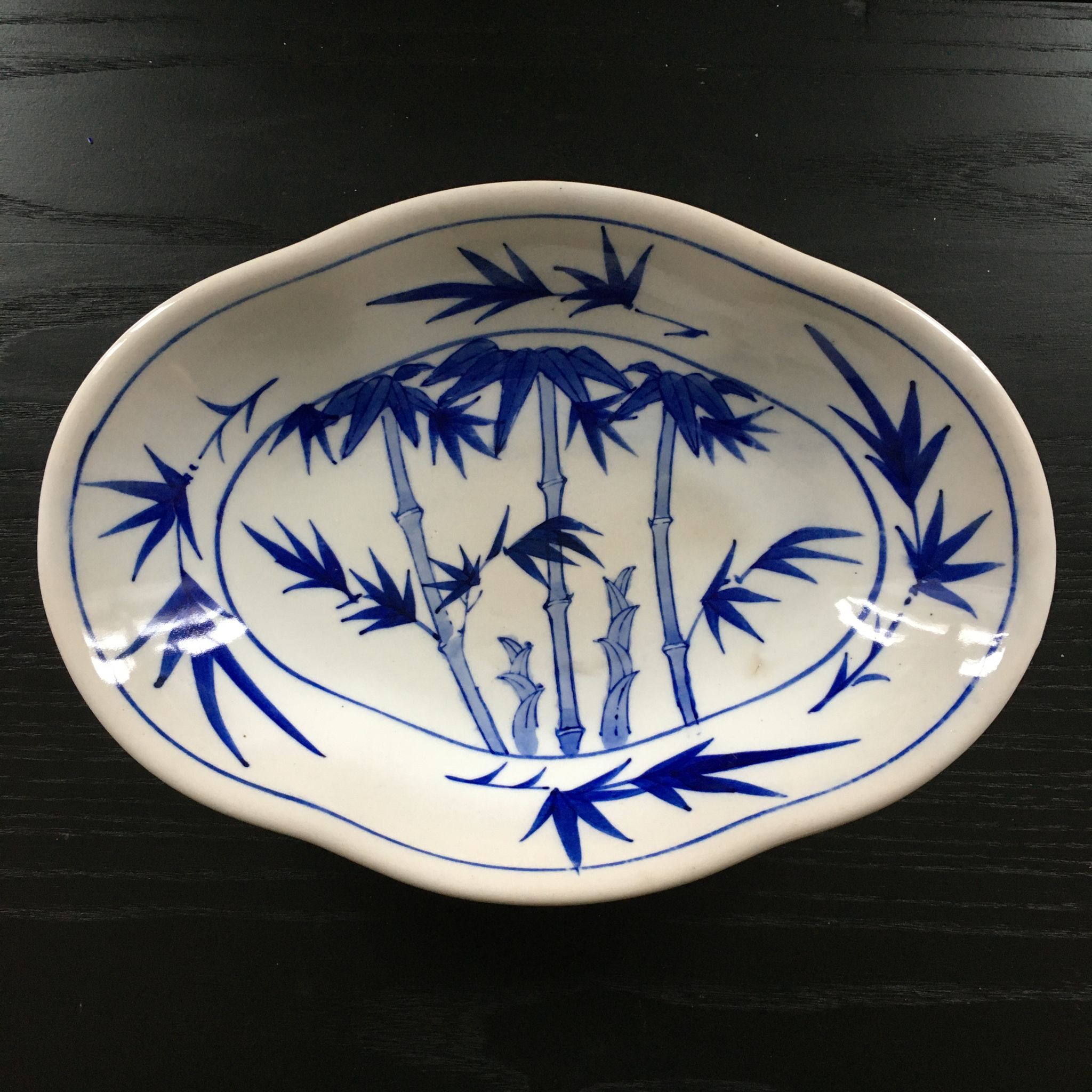 Chinese cup decorated with blue bamboo.