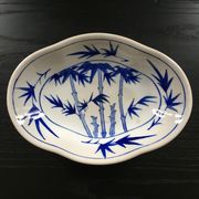 Chinese cup decorated with blue bamboo.