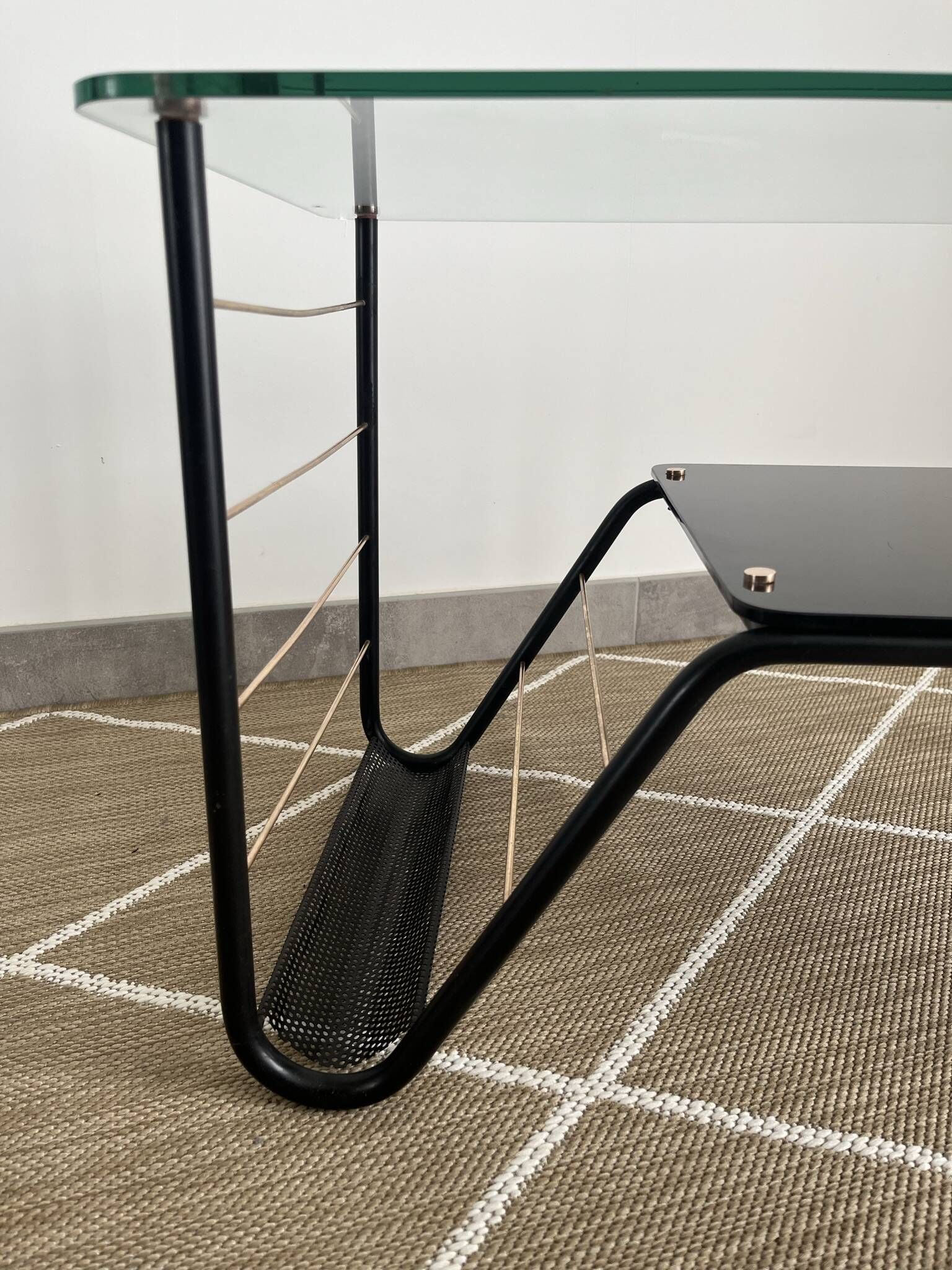 Metal and glass coffee table with magazine rack by Roche Bobois from the 1950s.