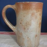 Suite of five sandstone mugs