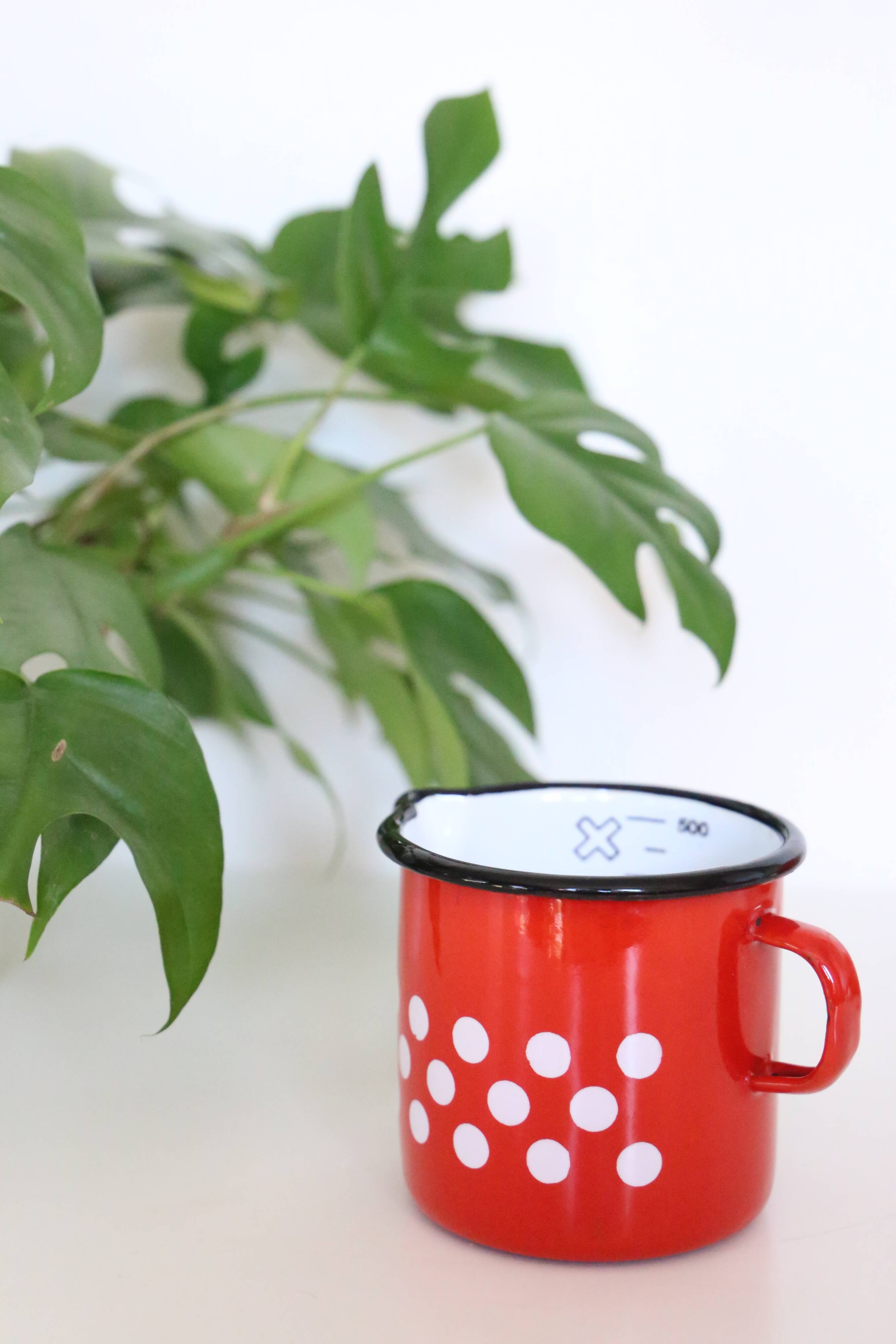 Red enamelled metal milk pot