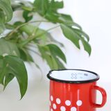 Red enamelled metal milk pot