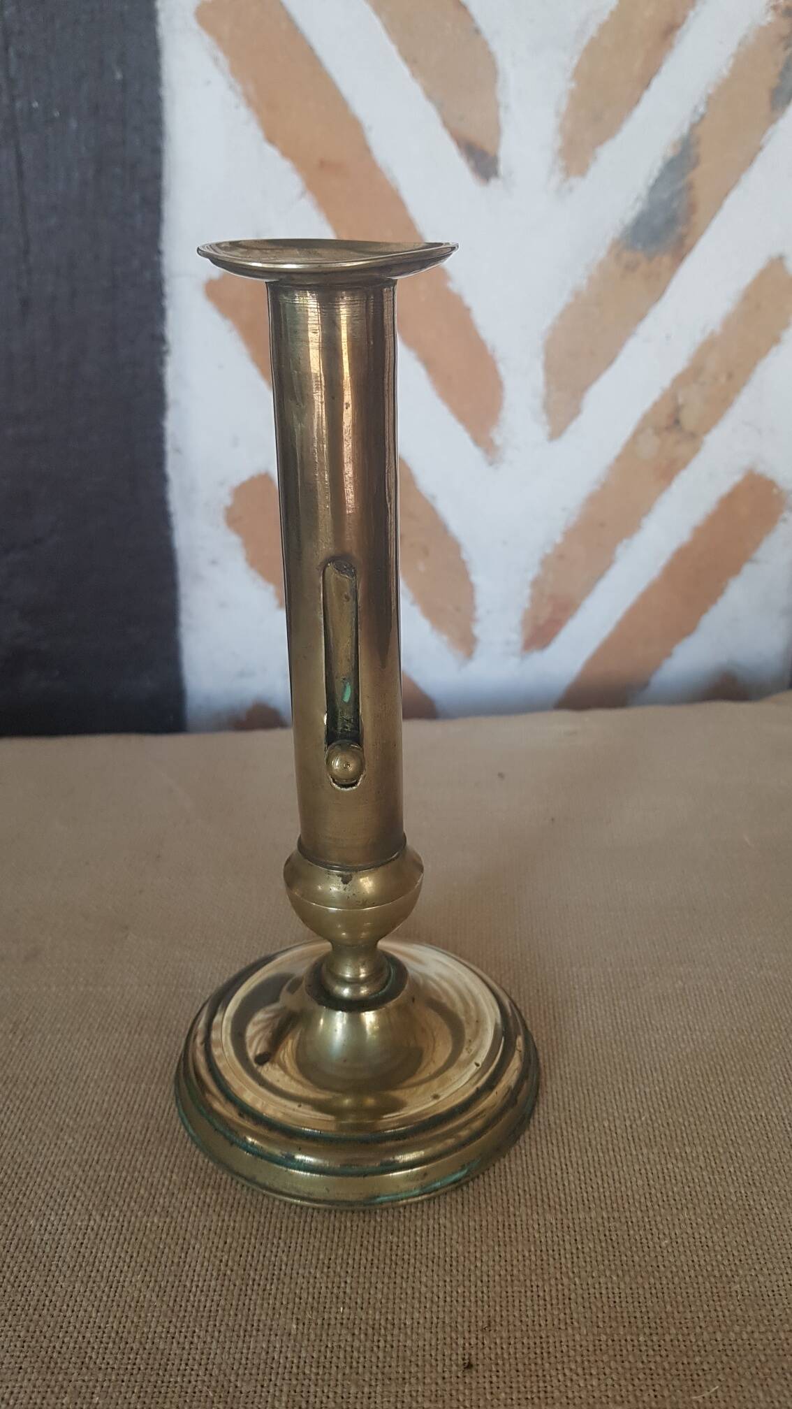 Brass candle holder with pusher and cup