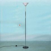 Vintage floor lamp in milky glass and chrome, minimalist uplight lighting.