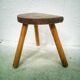 Tripod cowhide tabouret