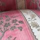 Pair of Louis XVI style armchairs in walnut and pink silk and ecru
