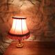 Vintage lamp, pink fringed pagoda shade and brass base.