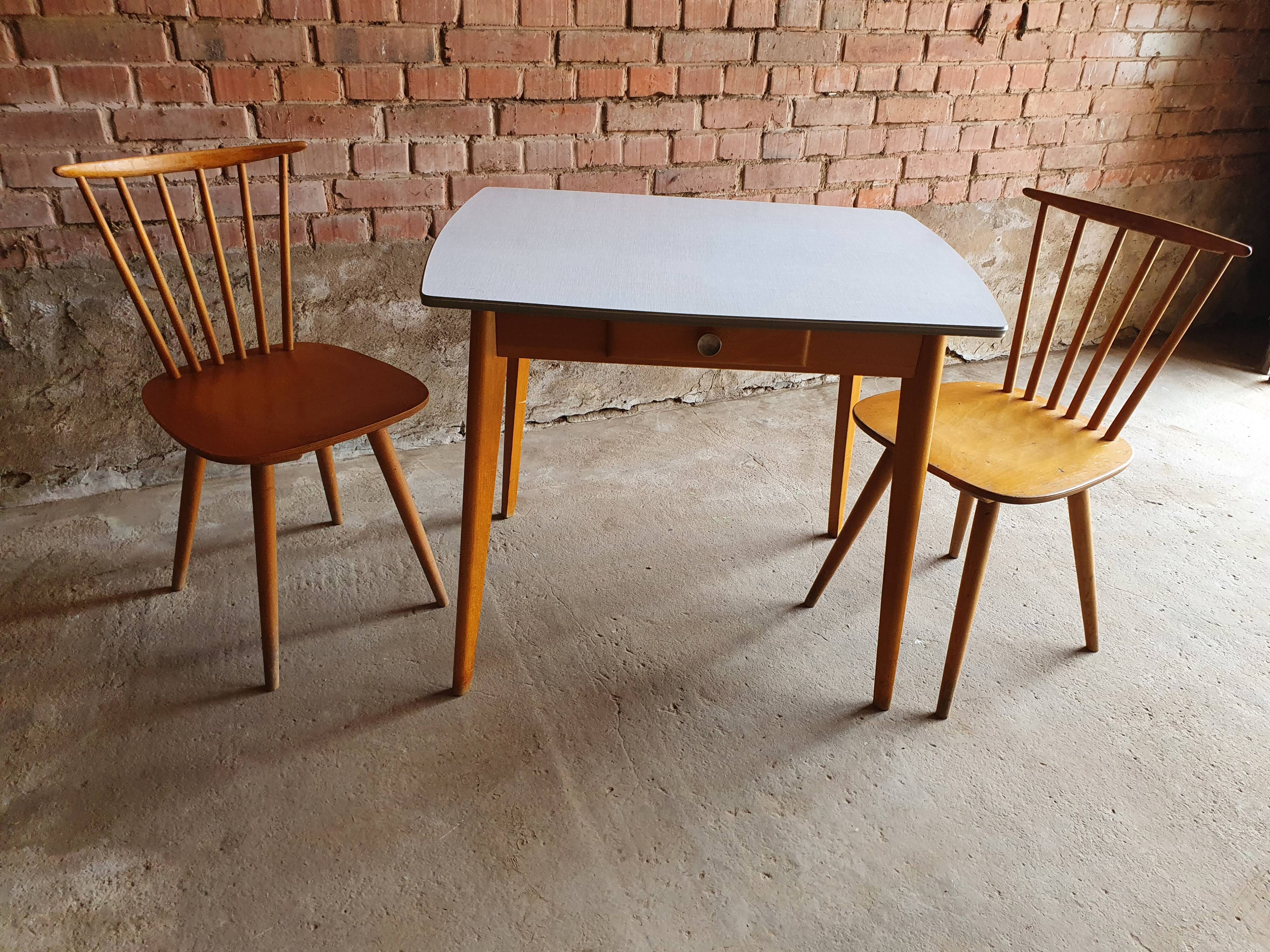 Together two Scandinavian chairs and its wooden and formica table