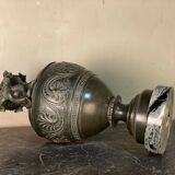 Bronze vase with snakes and a green patina, in the antique style.