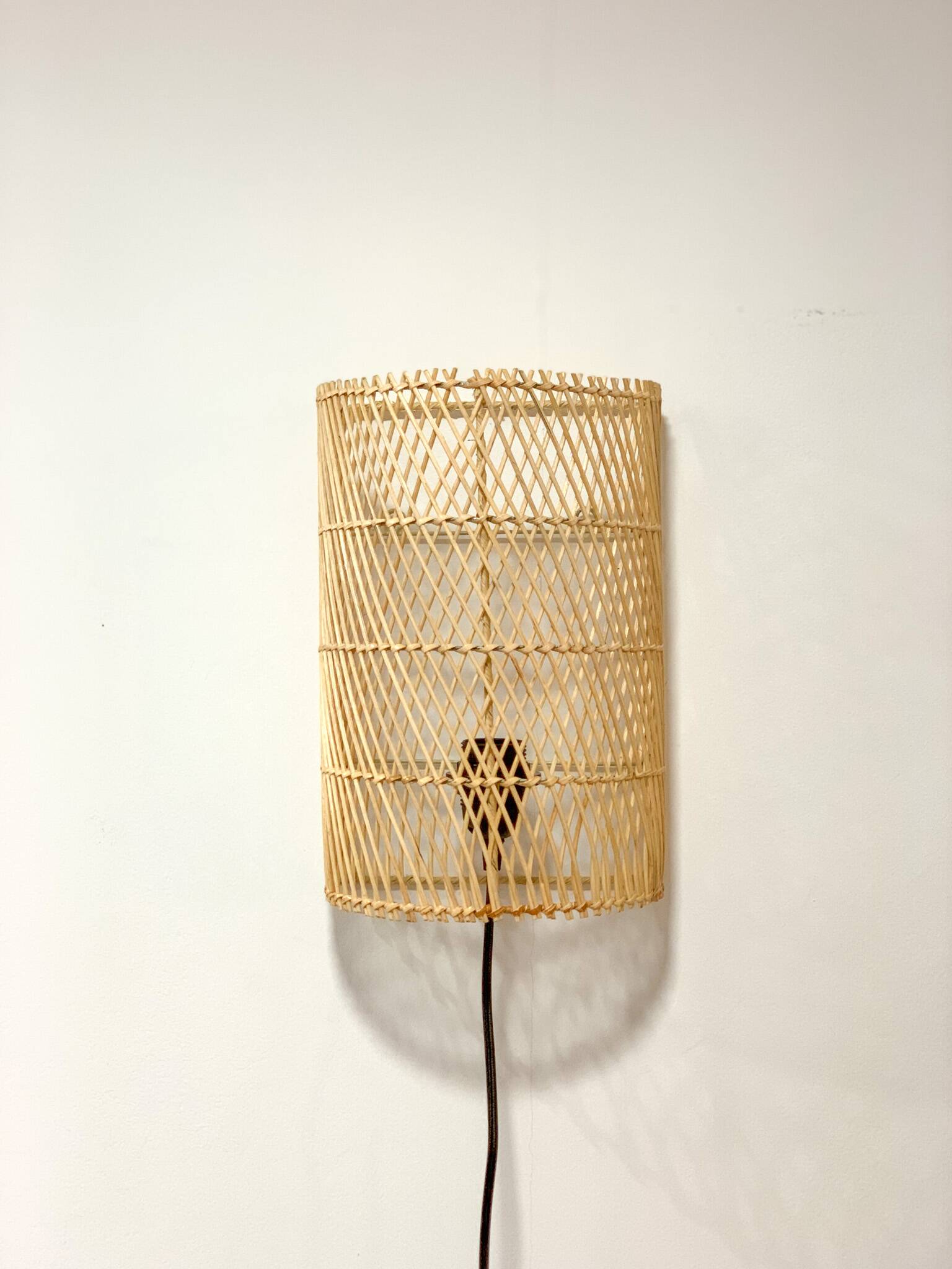 Natural rattan wall light
