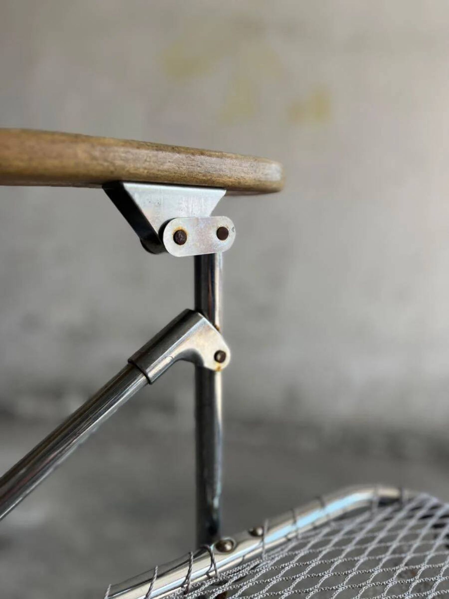 Set of two vintage folding chairs with an aluminium wire frame.