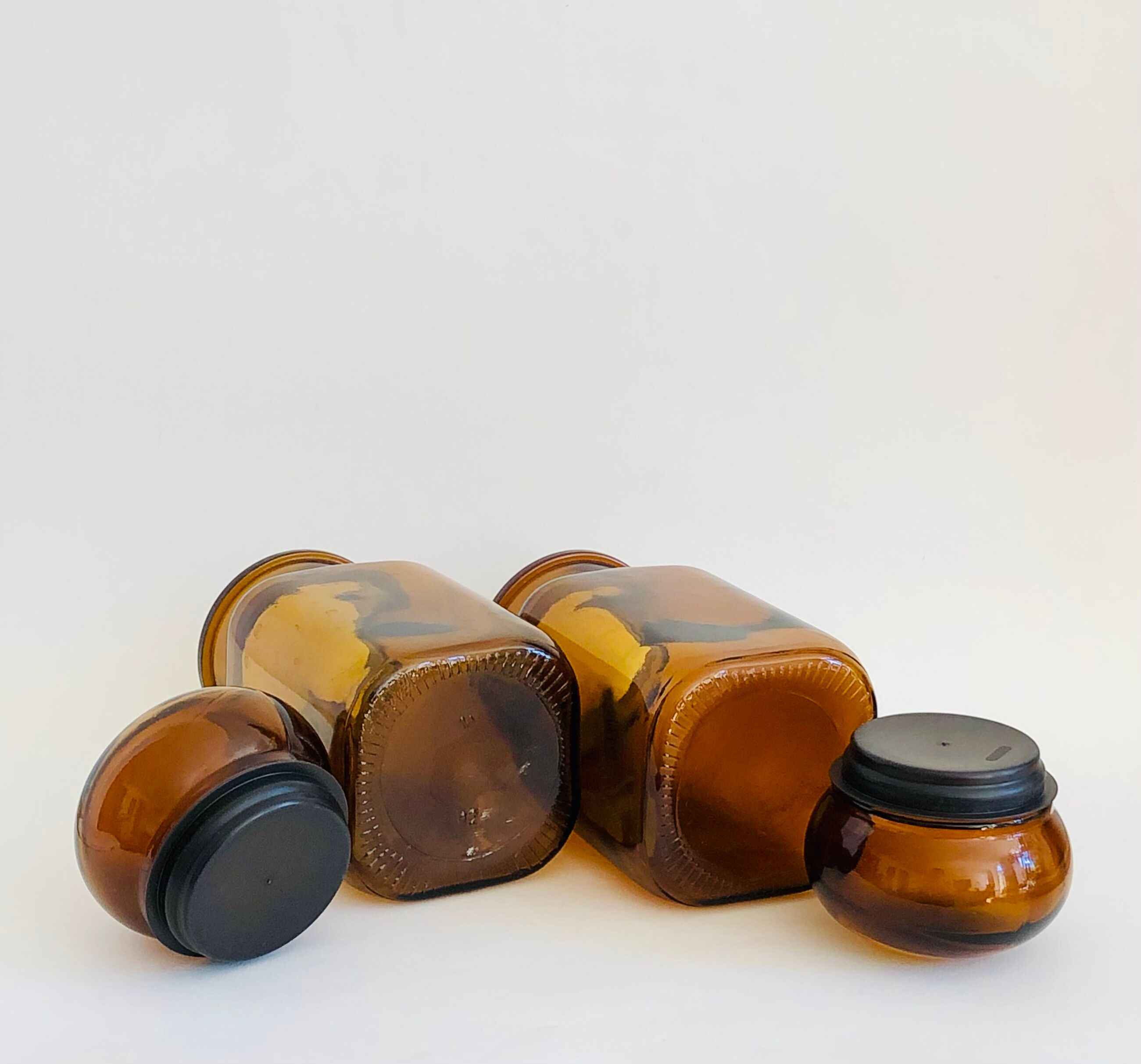 Pair of vintage amber glass jars