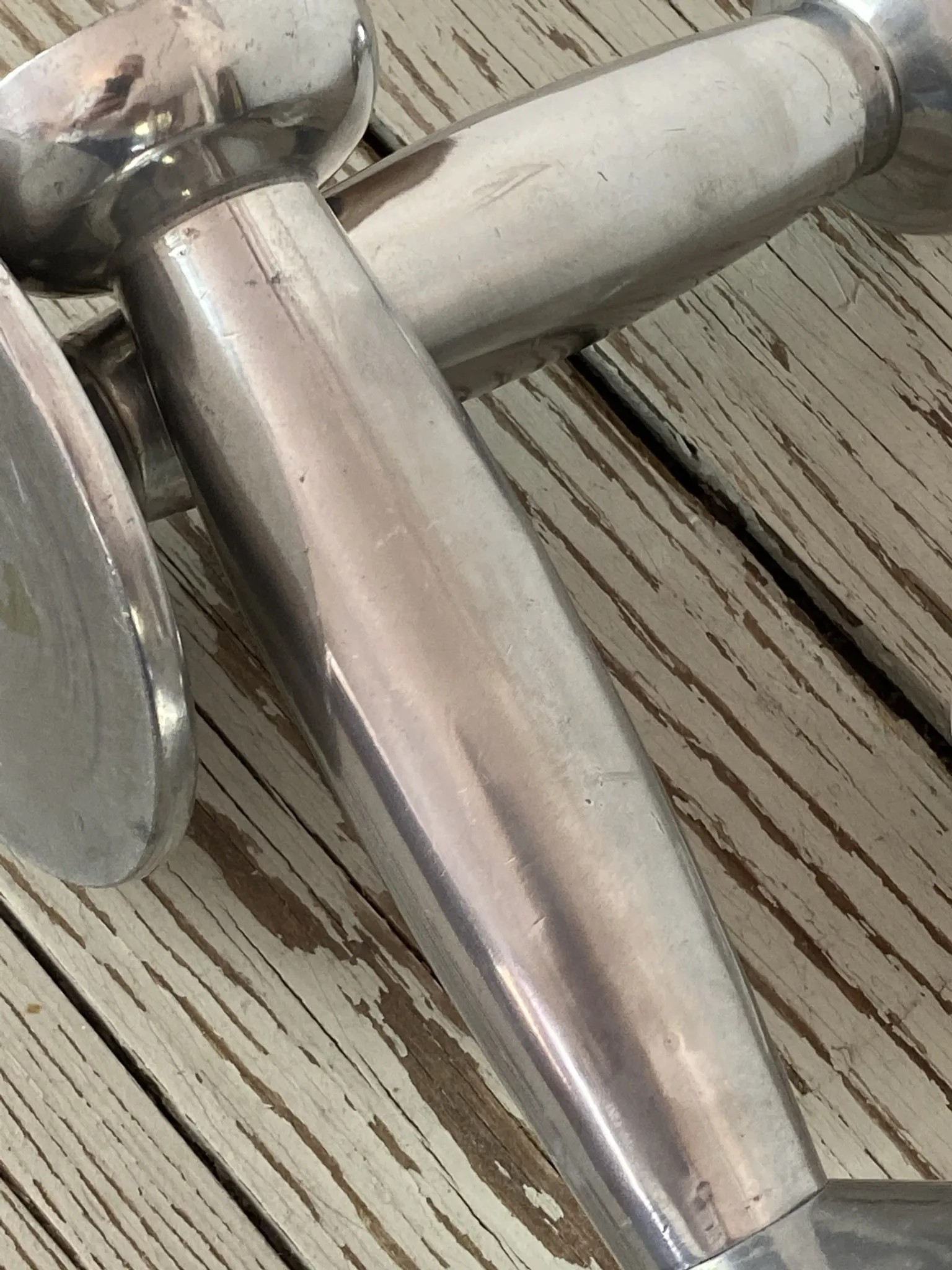 Pair of minimalist polished aluminium candle holders
