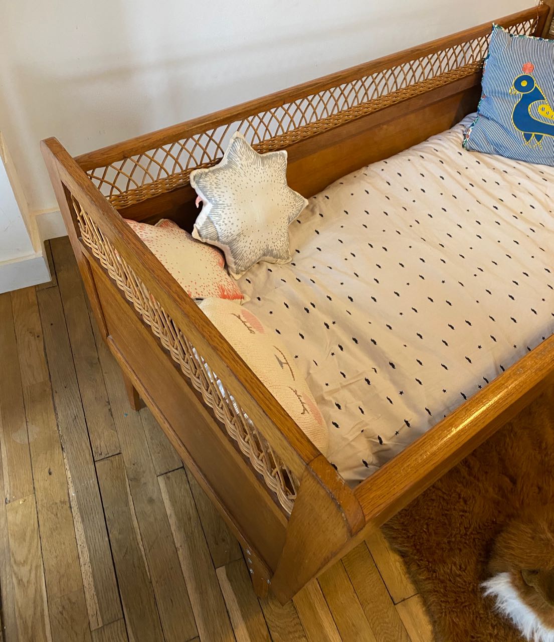 Wooden and wicker baby bed