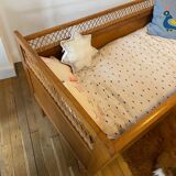 Wooden and wicker baby bed