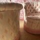 Pair of Hollywood Regency style cabriolet armchairs in satin pink, 1970s.