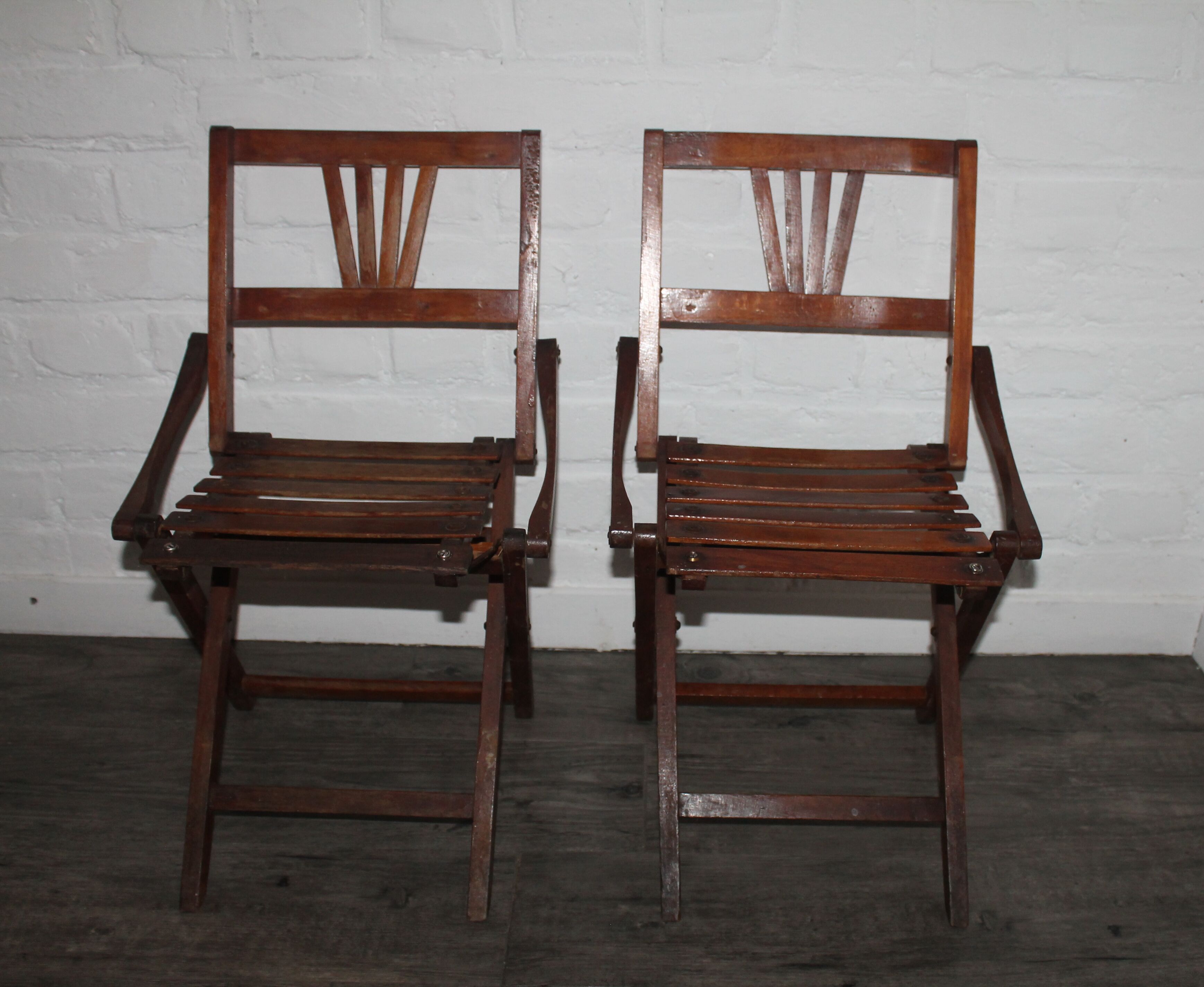 2 wooden folding chairs
