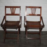 2 wooden folding chairs