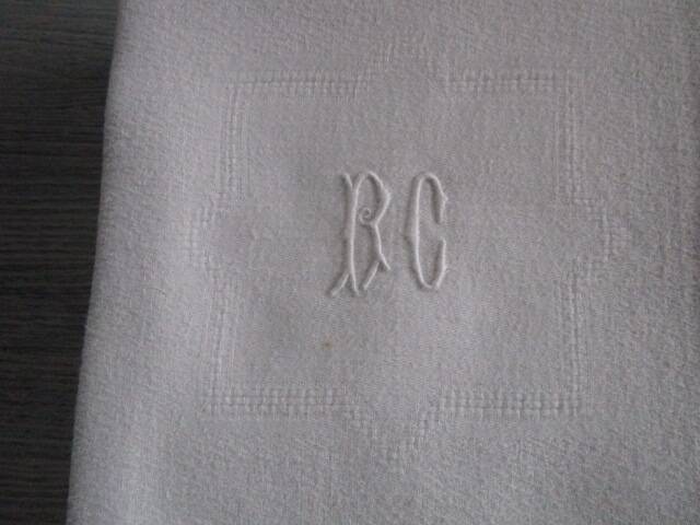 11 large old damask napkins, monogrammed