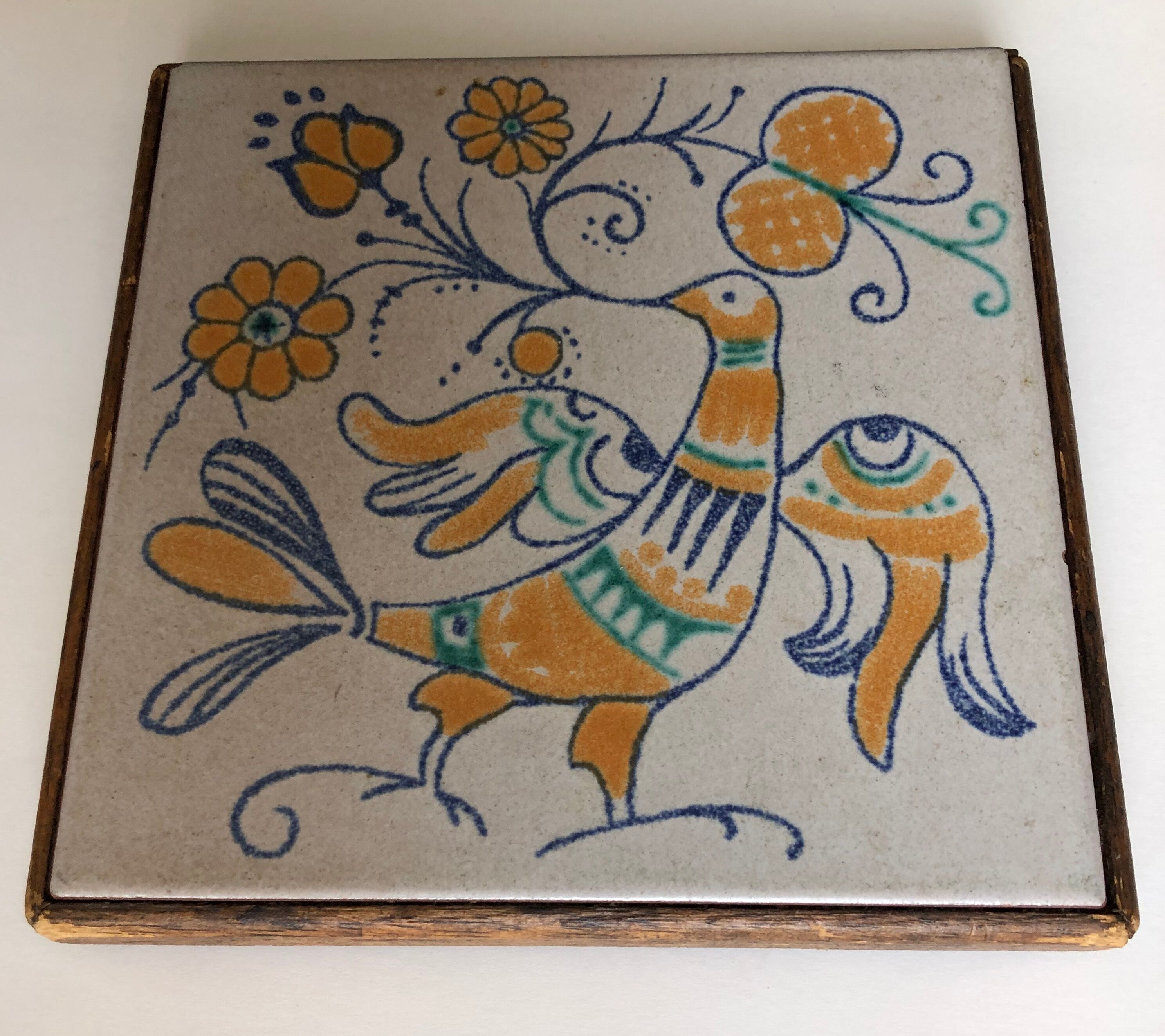 Earthenware flat underside on wooden base