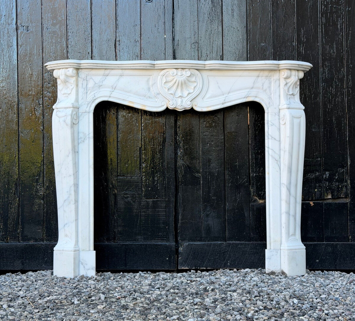 Louis XV style fireplace in Carrara marble, around 1900.