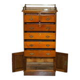 Victorian high chest of drawers in walnut with a bronze gallery.