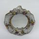 Antique porcelain mirror from Dresden with relief flowers and rococo decoration.