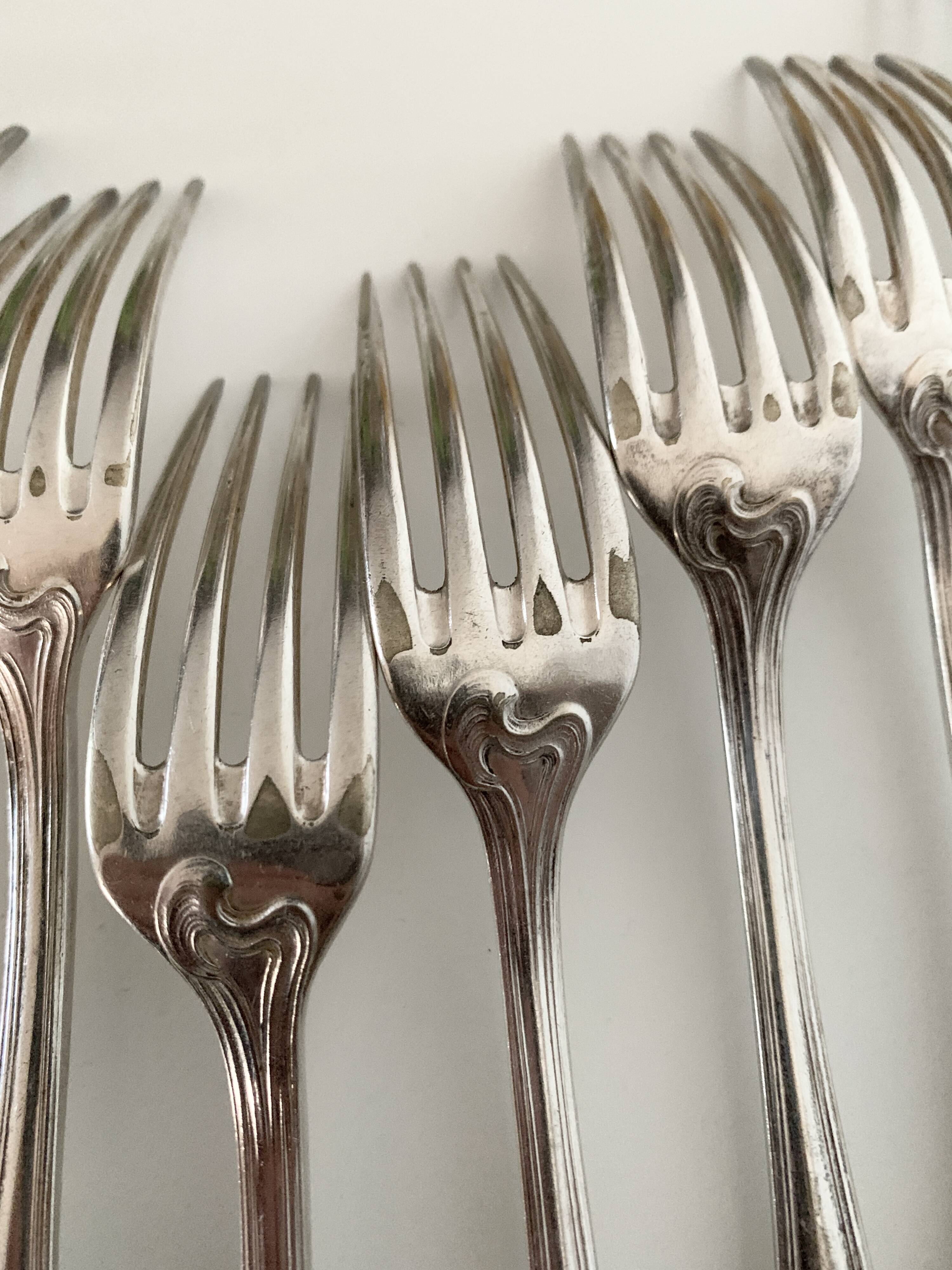 Nine large Ercuis silver-plated forks