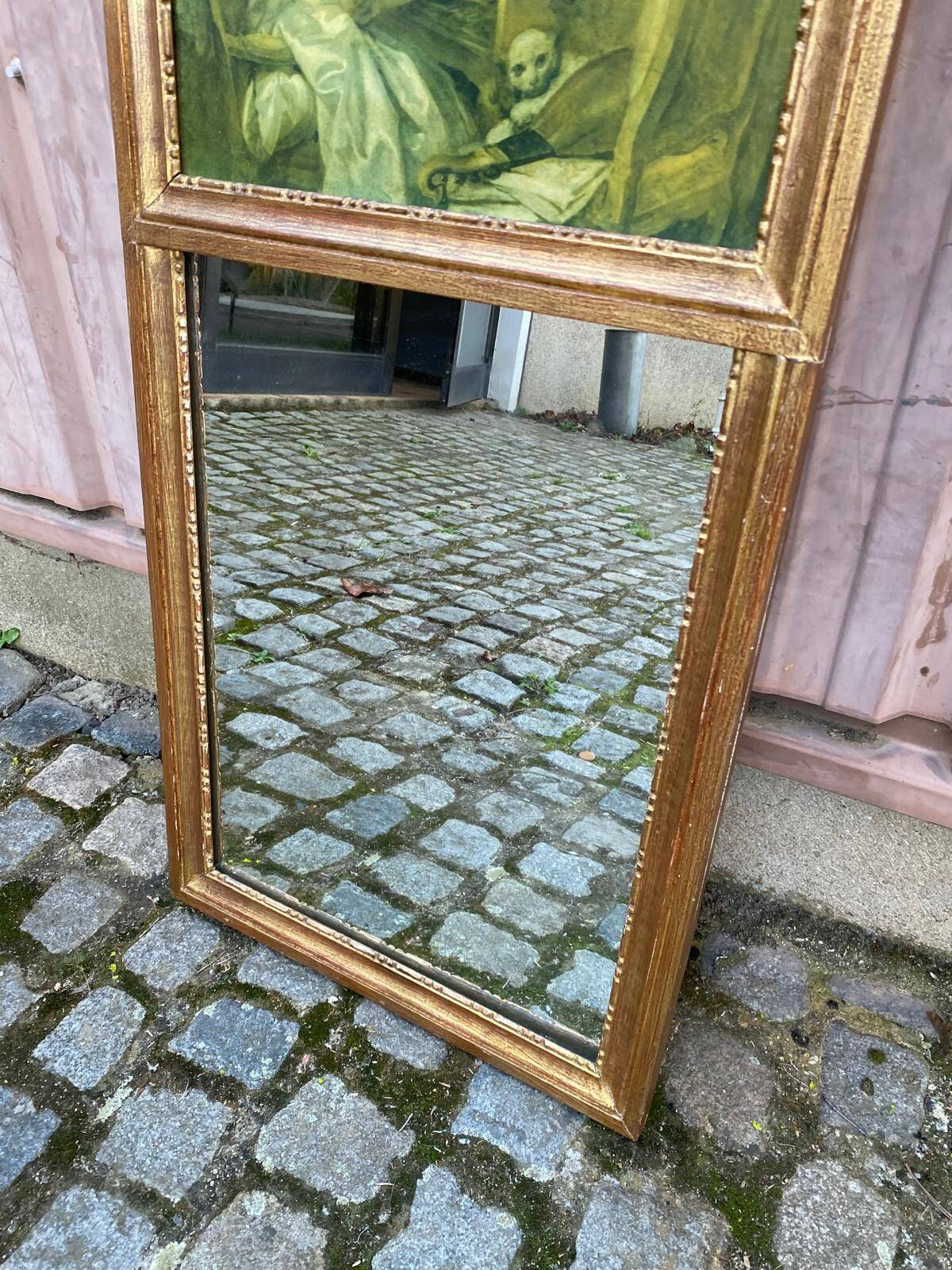 19th-century trumeau with mirror and music lesson canvas.