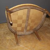 Pair of Louis XVI Bergères in walnut, late 18th century.