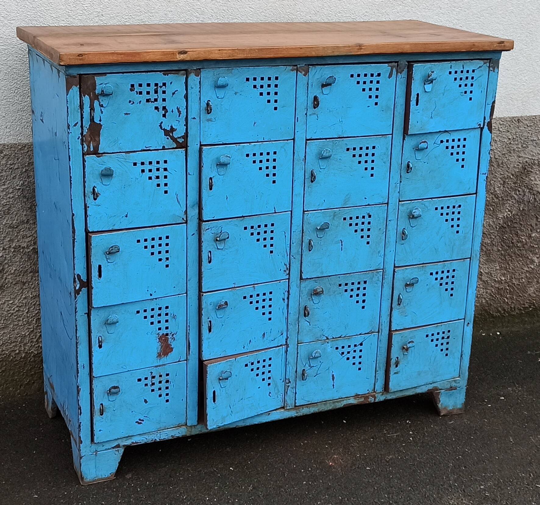 Old blue metal locker with wooden top